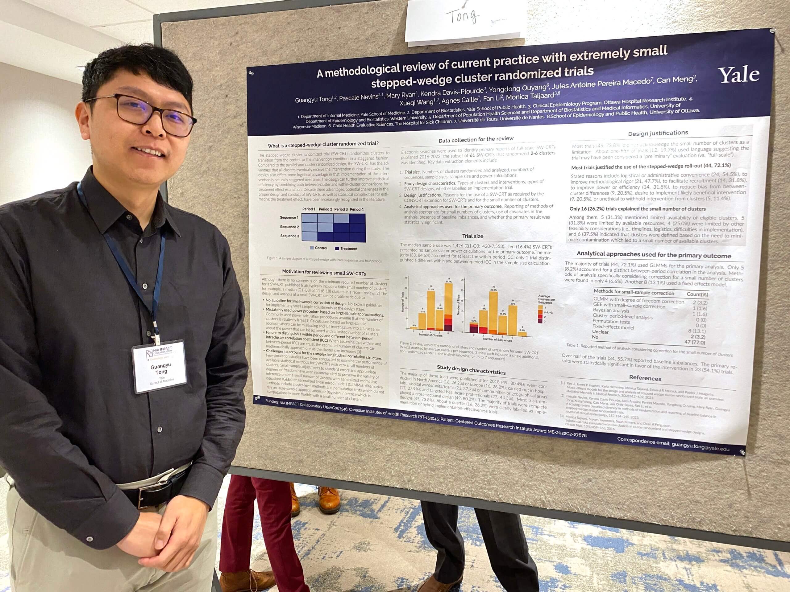 Guangyu Tong standing next to their poster at the 2024 IMPACT Conference