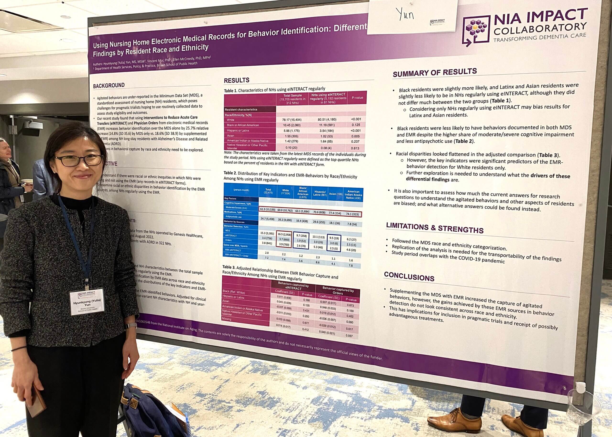 Hyunkyung (Yulia) Yun standing next to their poster at the 2024 IMPACT Conference