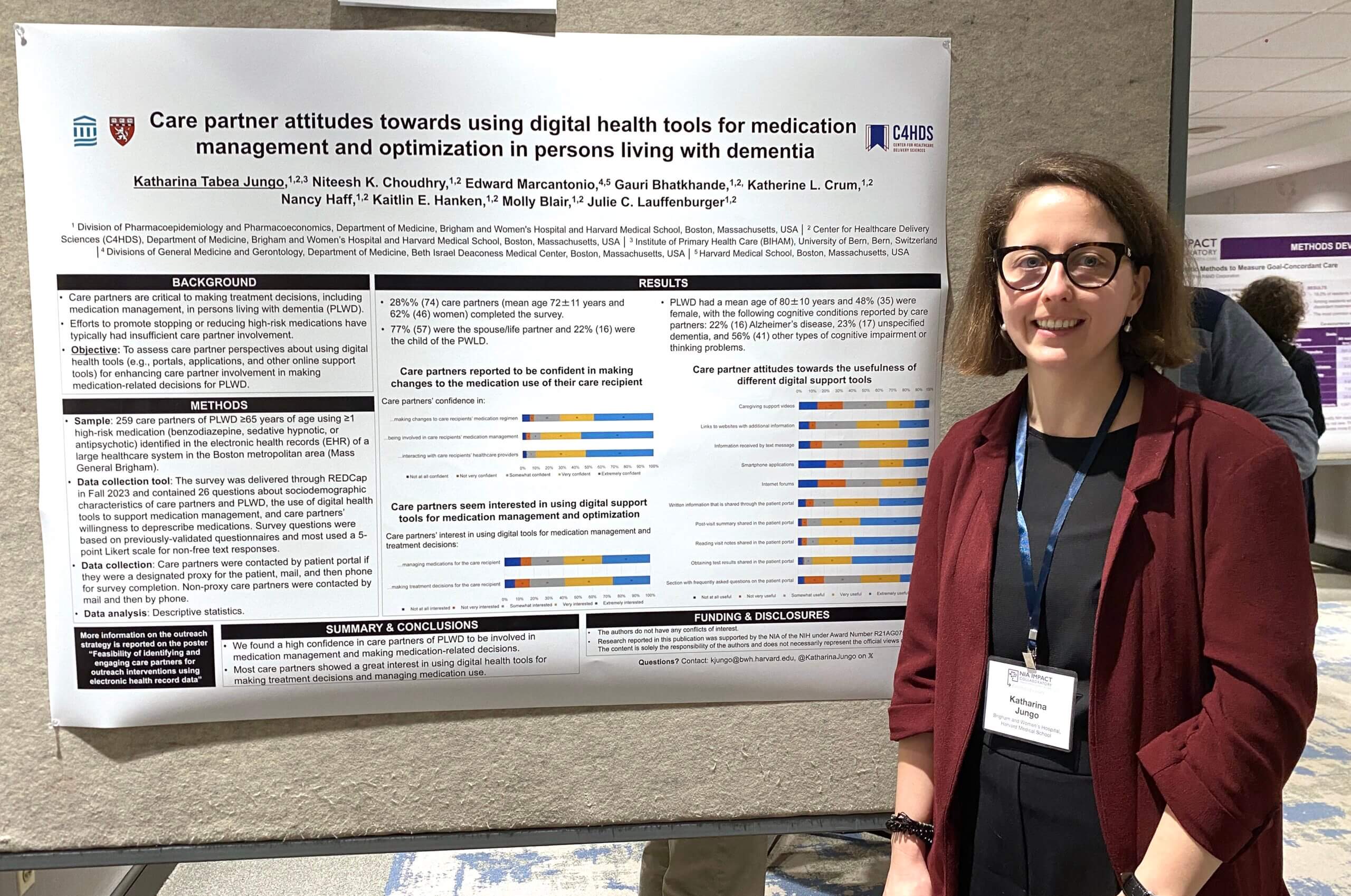 Katharina Jungo standing next to their poster at the 2024 IMPACT Conference