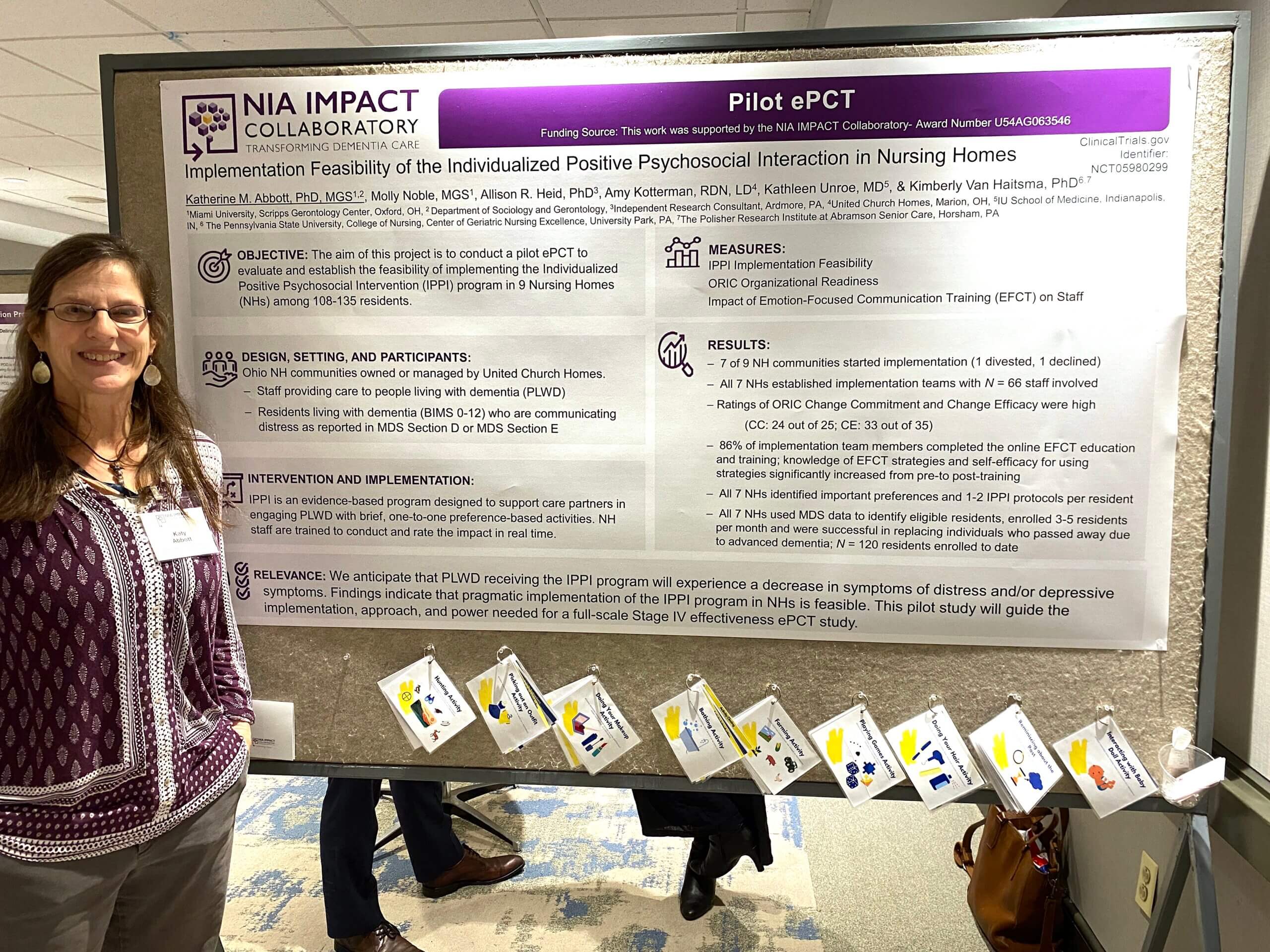 Katherine Abbott standing next to their poster at the 2024 IMPACT Conference