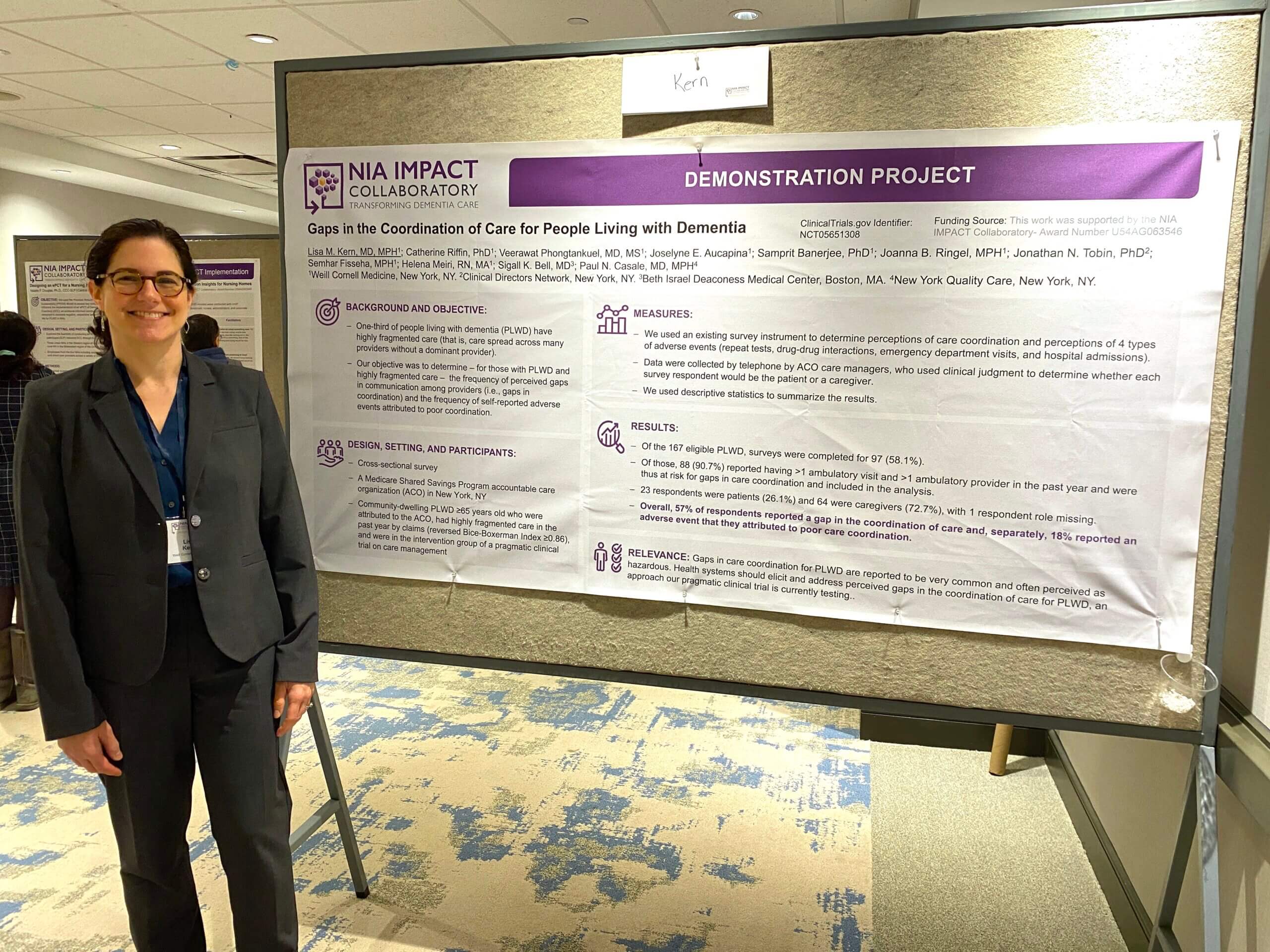 Lisa Kern standing next to their poster at the 2024 IMPACT Conference