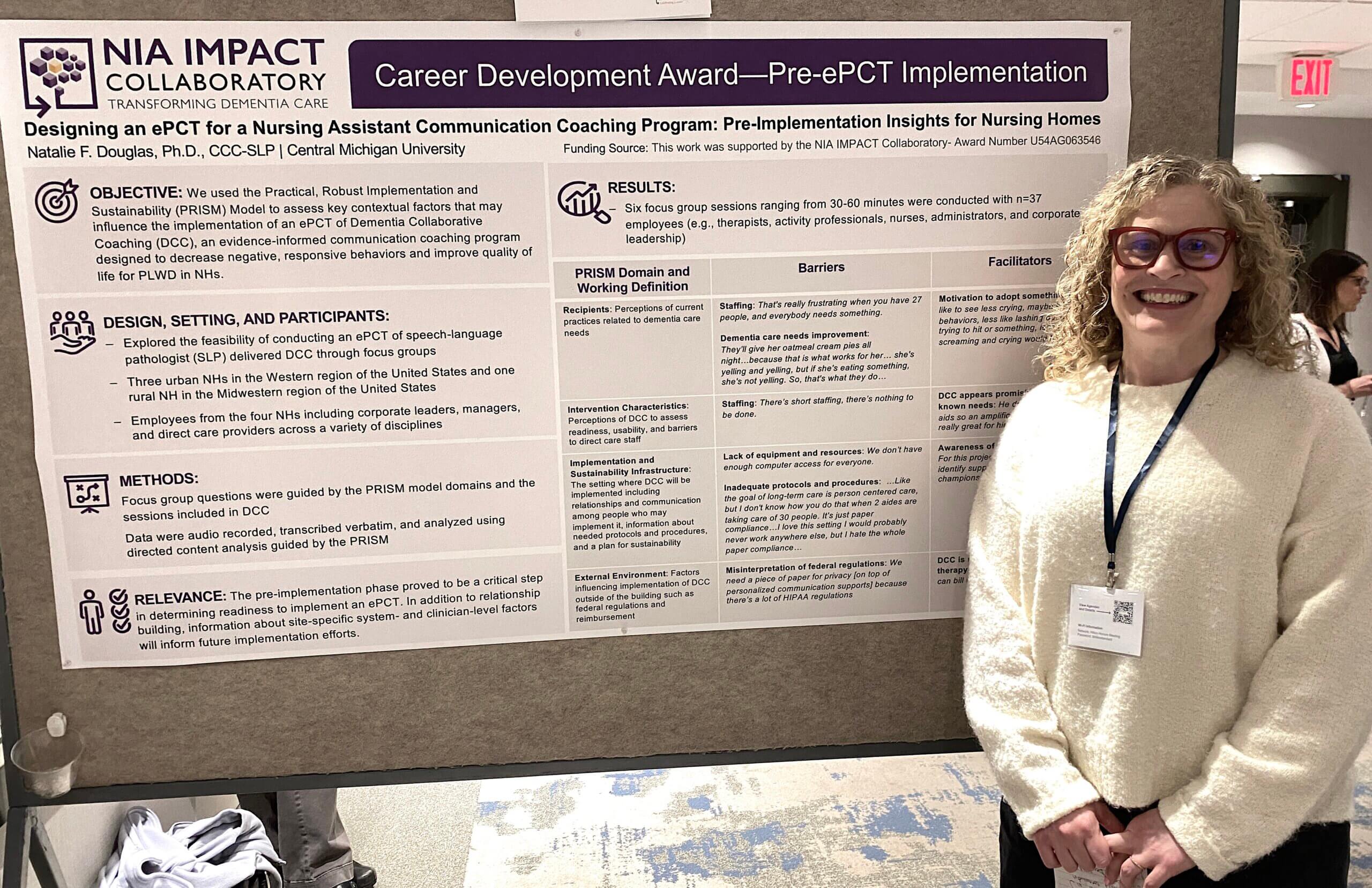 Natalie Douglas standing next to their poster at the 2024 IMPACT Conference