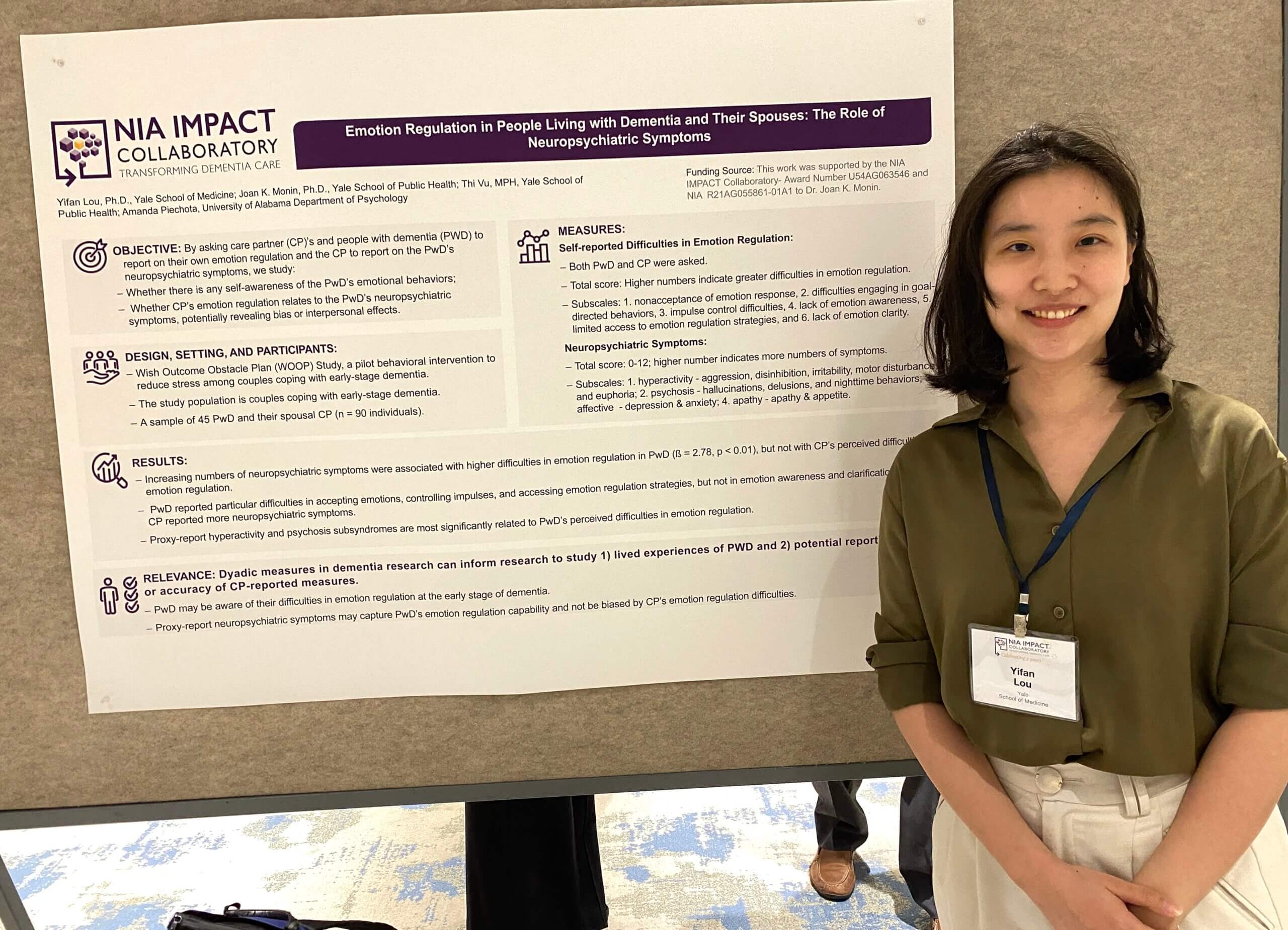 Yifan Lou standing next to their poster at the 2024 IMPACT Conference